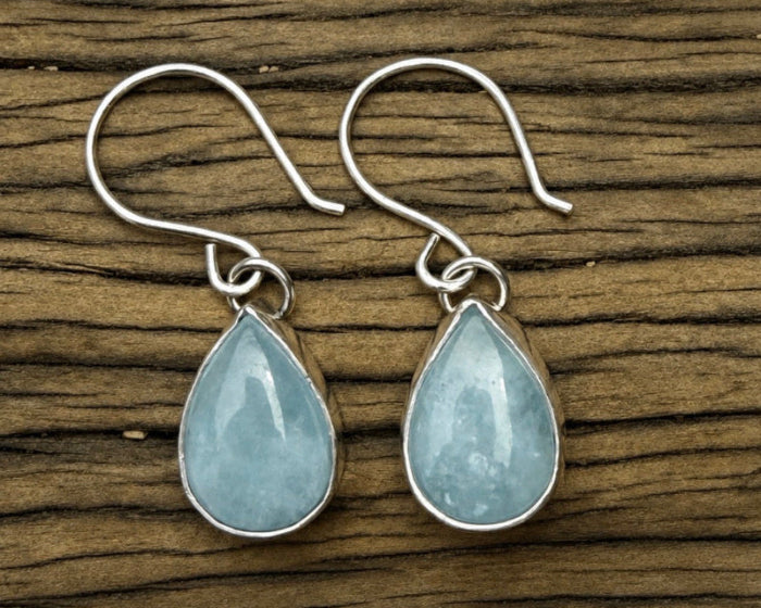 Blue teardrop shaped aquamarine drop earrings in sterling silver